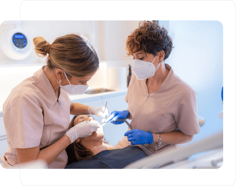 Two dental staff members completing a routine appointment on a patient