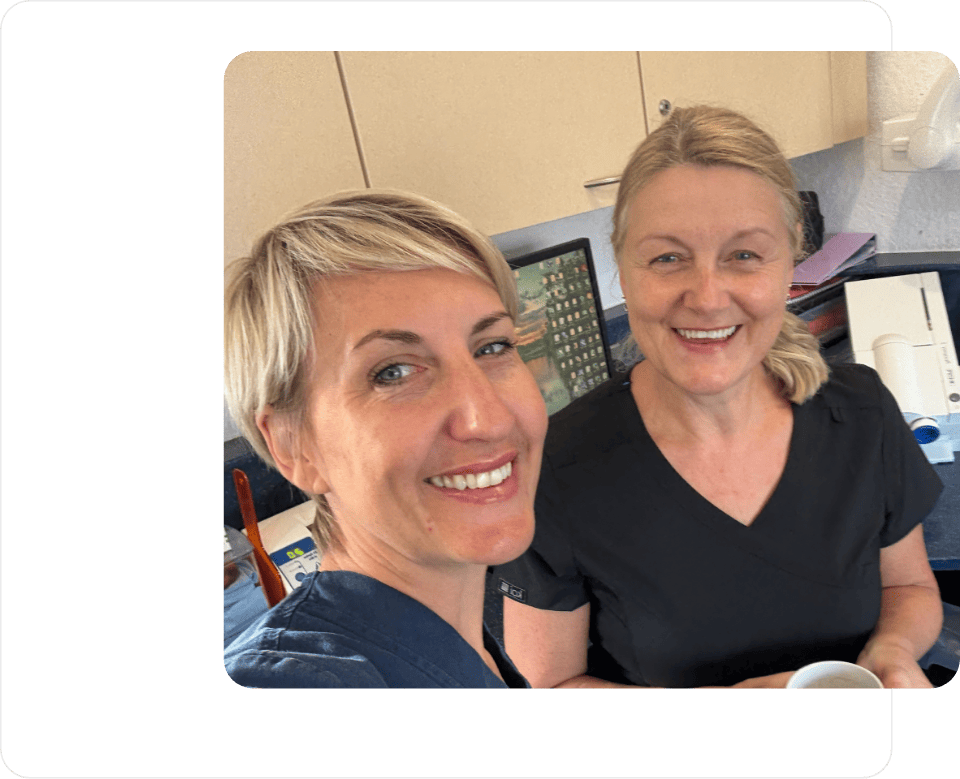 Heather and Lorraine smiling whilst working at the Fill-ins Locum Agency office